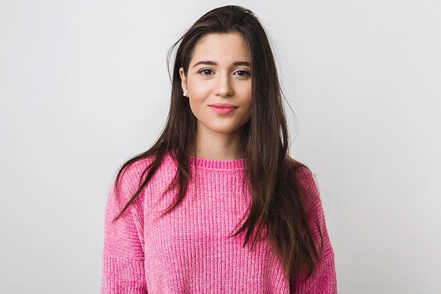 young-beautiful-woman-pink-warm-sweater-natural-look-smiling-portrait-isolated-long-hair copia